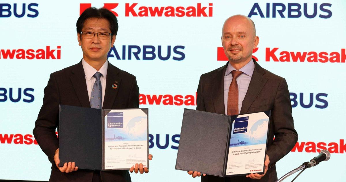 Kawasaki Hydrogen Strategy division deputy general manager Motohiko Nishimura (left) and Airbus head of North Asia Stéphane Ginoux celebrate the signing of an MOU on hydrogen supply and infrastructure collaboration. (Photo: Airbus)