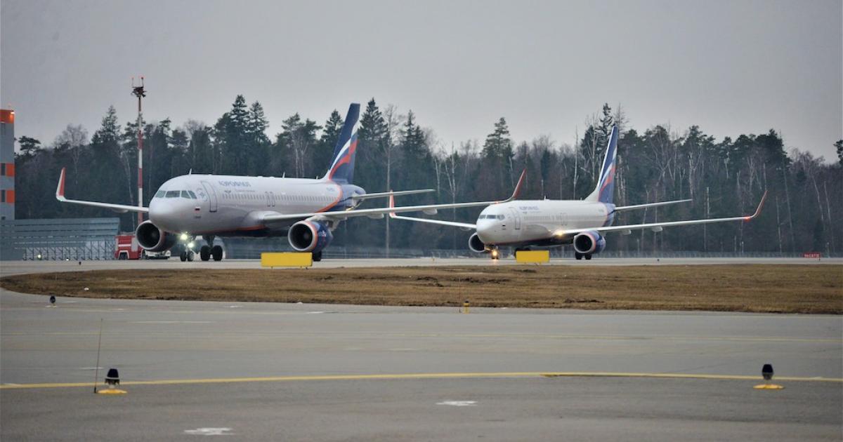 An Airbus A320 (left) and a Boeing 737-800 in Aeroflot colors taxi at Moscow Sheremetyevo Airport. (Photo: Vladimir Karnozov)