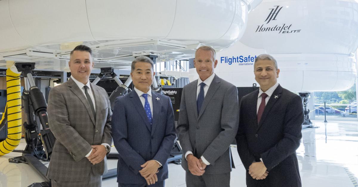 From left, FlightSafety executive v-p of sales and marketing Nate Speiser; Honda Aircraft president and CEO Hideto Yamasaki; FlightSafety president and CEO Brad Thress; and Honda Aircraft head of commercial business unit and customer service v-p Amod Kelkar at FlightSafety's Greensboro Learning Center.