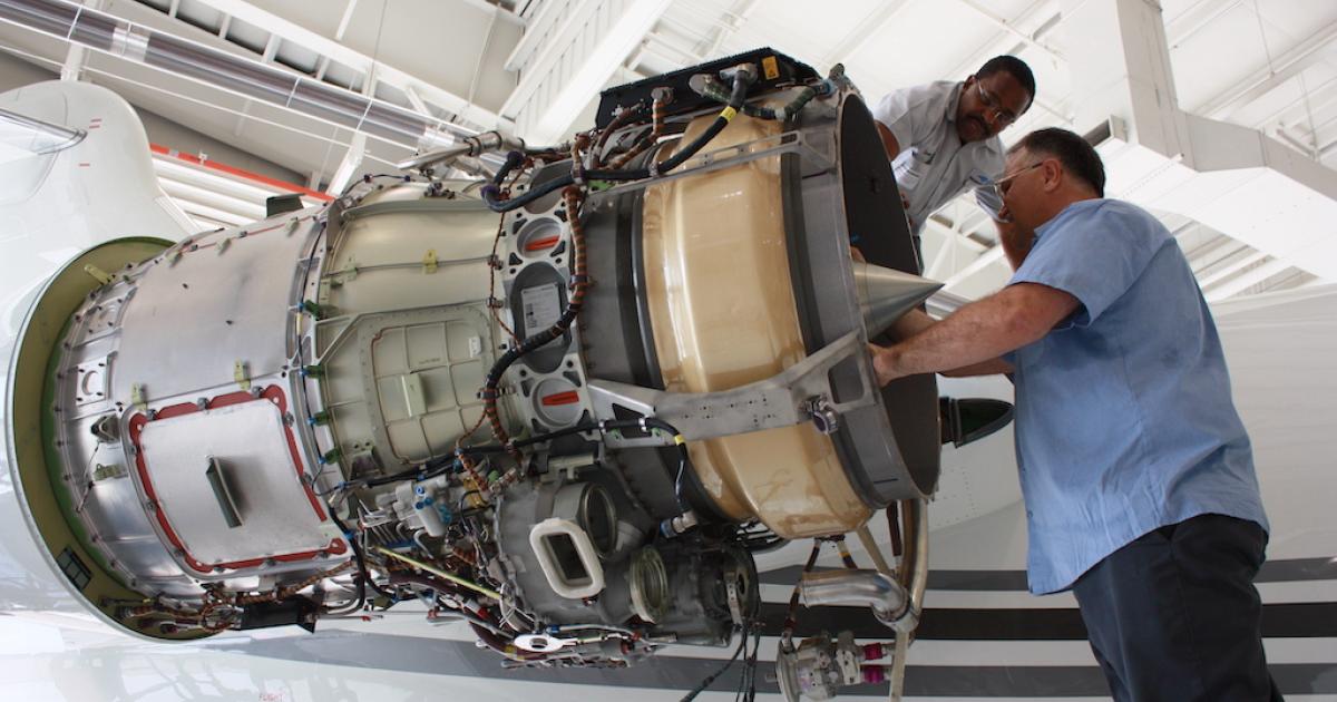 StandardAero technicians work on a Honeywell HTF7000 series turbofan engine. (Photo: StandardAero)