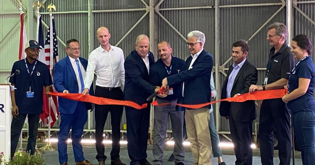 Daher executives celebrate the completion of its acquisition of the now-former Triumph metallic and composite aerostructures assembly facility in Stuart, Florida. (Photo: Chad Trautvetter/AIN)