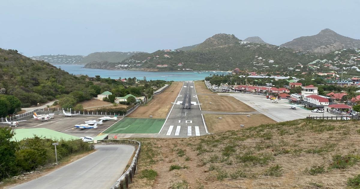 Gustav III Airport on St. Barthélemy offers an approach and landing so challenging, pilots must be specially qualified to perform it. In addition to a steep descent between hills, aircraft must come to a stop on the 2,100-foot runway or end up in the waters of the Caribbean. (Photo: Curt Epstein/AIN)
