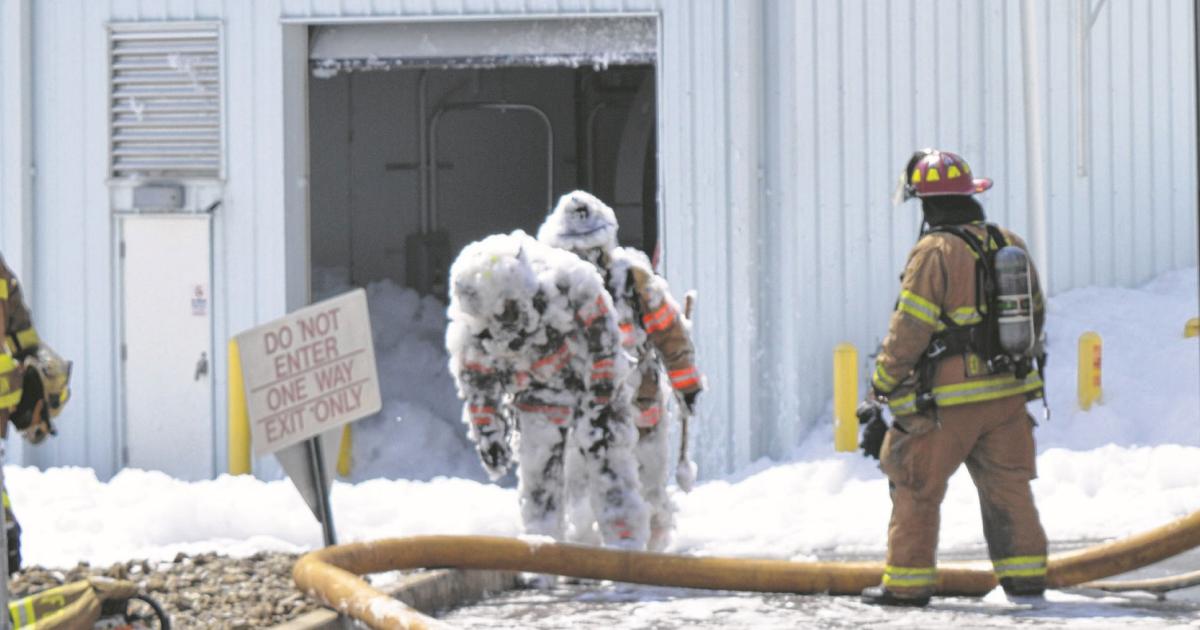 Fire fighters attempting to rescue a man trapped by an accidental fire foam discharge in a large aircraft maintenance hangar at Ohio's Wilmington Air Park on August 7 faced difficult conditions. (Photo: Wilmington News Journal)