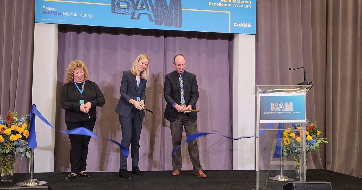 (From left) Auburn Mayor Nancy Backus, Melissa Orme, vice president of Boeing Additive Manufacturing, and Steve Chisholm, vice president and chief engineer for Boeing mechanical and structural engineering, symbolically cut a ribbon during the opening ceremony of Boeing’s Center of Additive Manufacturing Excellence in Auburn, Washington, on September 23, 2022. (Photo: Hanneke Weitering)