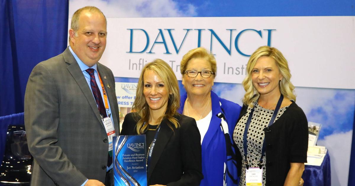 John Detloff, COO of Davinci Inflight Training Institute presents the Private and Business Aviation Food Safety Excellence Award to Jet Aviation's director of inflight services Dani Mickel at NBAA-BACE while Davinci founding partner Paula Kraft and Cindi Hillock, Jet Aviation's senior manager of inflight services look on. (Photo David McIntosh/AIN)