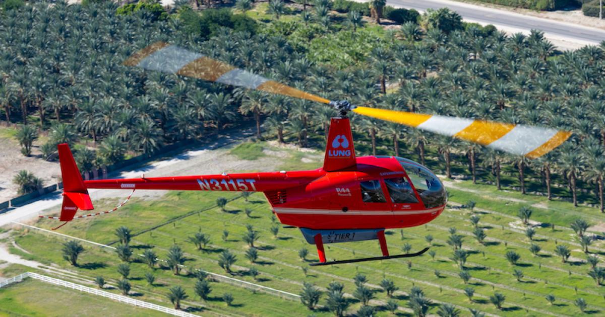 An R44 helicopter powered entirely by an electric propulsion system flies over Coachella on the way to Palm Springs International Airport. (Photo: Tier 1 Engineering)