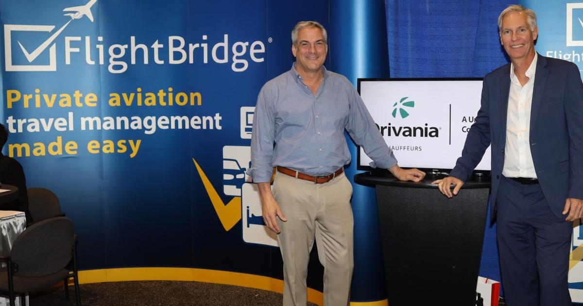 FlightBridge CEO Dudley King (left) and Frank Davidson, senior v-p of sales, for Drivania Chauffeurs, celebrate their recent integration. (Photo: Drivania Chauffeurs)