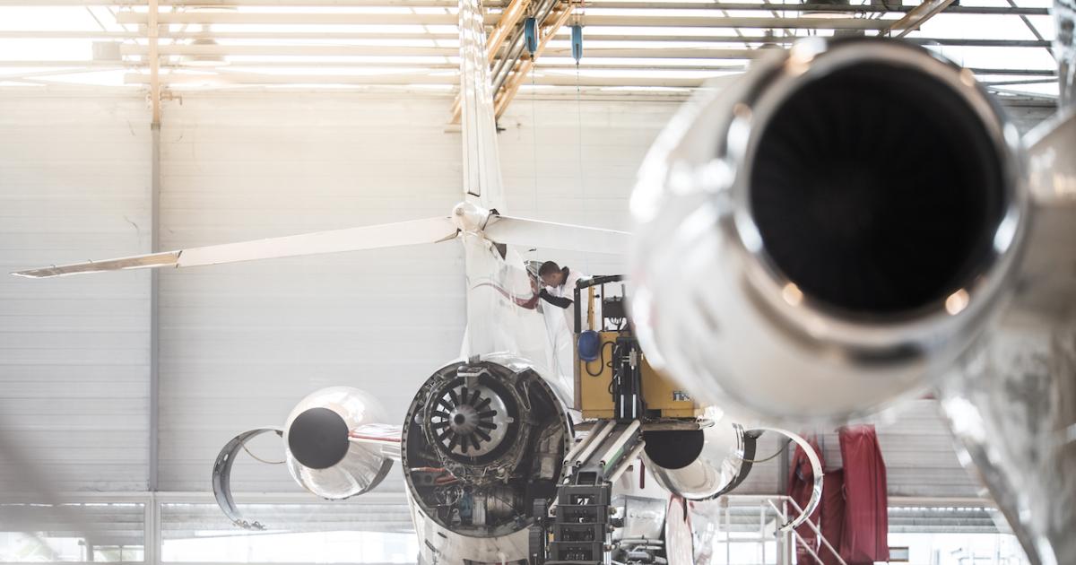 Aircraft technician working on a Falcon 2000