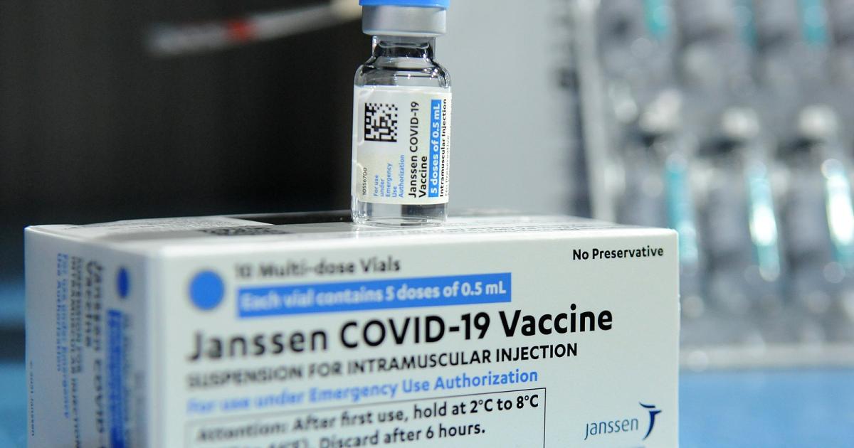 Johnson & Johnson's Janssen Covid-19 vaccine vial atop packaging