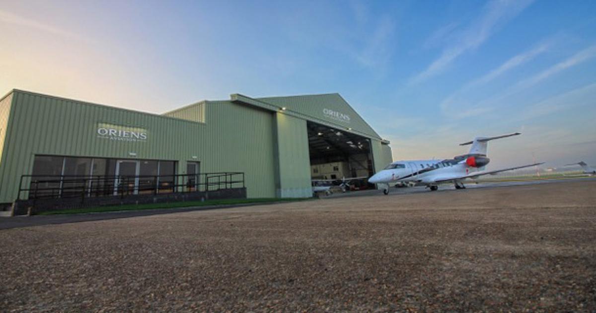 Oriens Aviation facility at London Biggin Hill Airport with business jet parked in front of hangar
