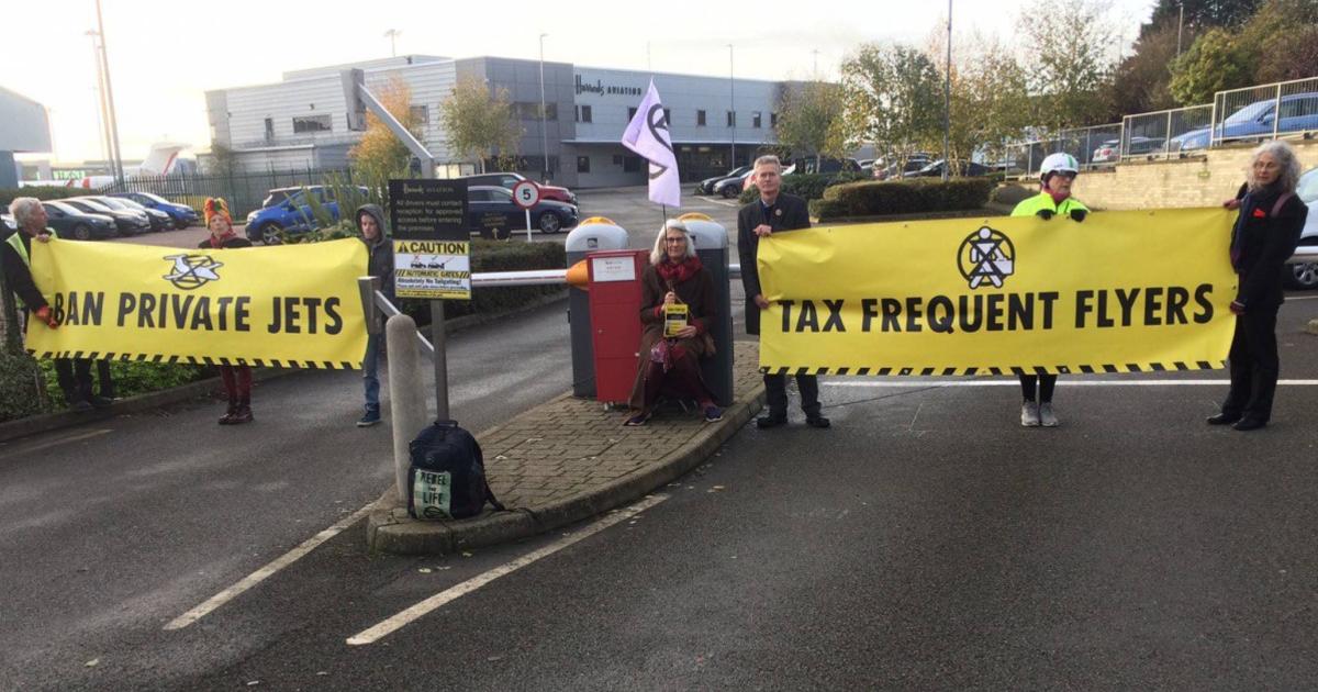 Environmental protesters outside the business aviation area of London Luton Airport.