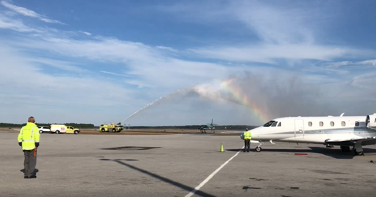 private jet receiving water salute