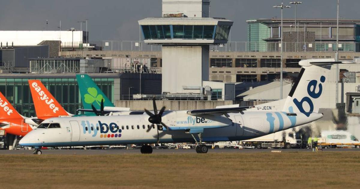 A Flybe De Havilland Dash 8-400 taxis at Manchester Airport in the UK. (Photo: Barry Ambrose)
