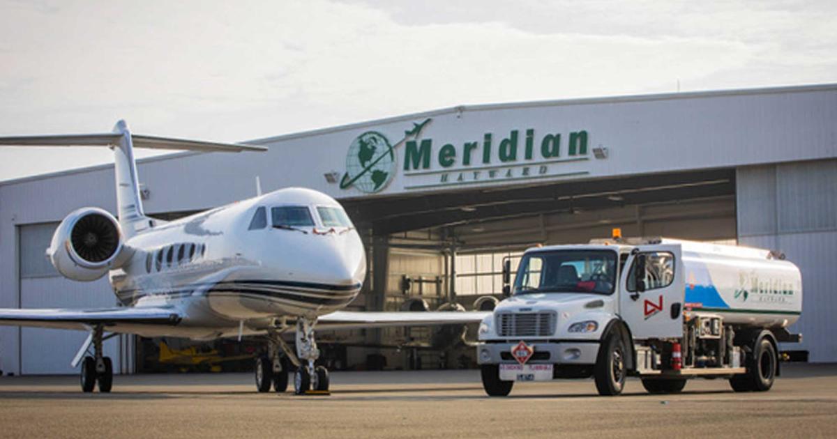 Meridian Hangar at Hayward Executive Airport with fuel truck and business jet parked in front