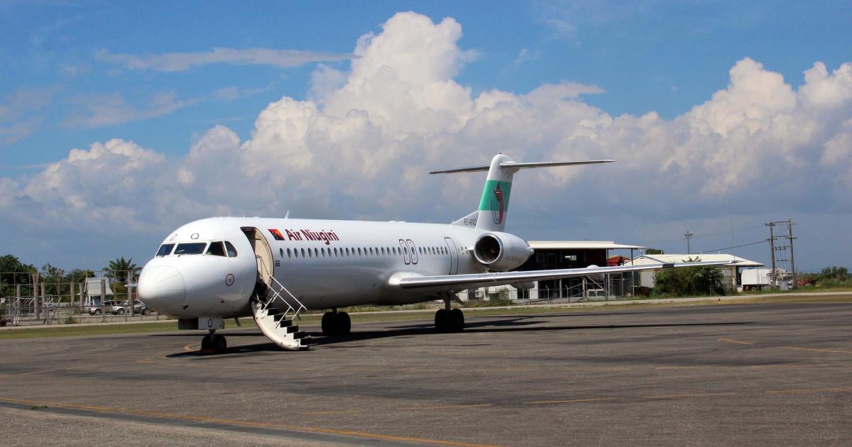 An Air Niugini Fokker 100 readies to accept passengers at Honiara in the Solomon Islands. (Photo: Flickr: <a href="http://creativecommons.org/licenses/by/2.0/" target="_blank">Creative Commons (BY)</a> by <a href="http://flickr.com/people/adelaide_archivist" target="_blank">Adelaide Archivist</a>)