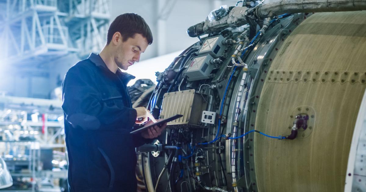 Vortex technician working on aircraft engine