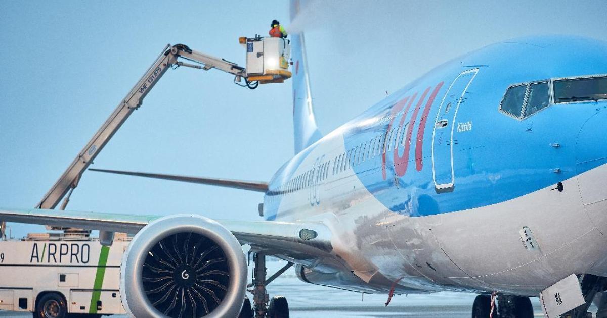 A TUI Boeing 737 Max 8 airliner undergoes de-icing.