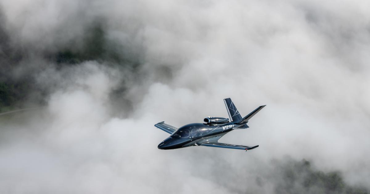 Cirrus Vision Jet single-engine jet in flight over clouds