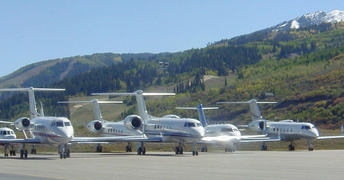 business jets lined up on ramp at Aspen-Pitkin County Airport