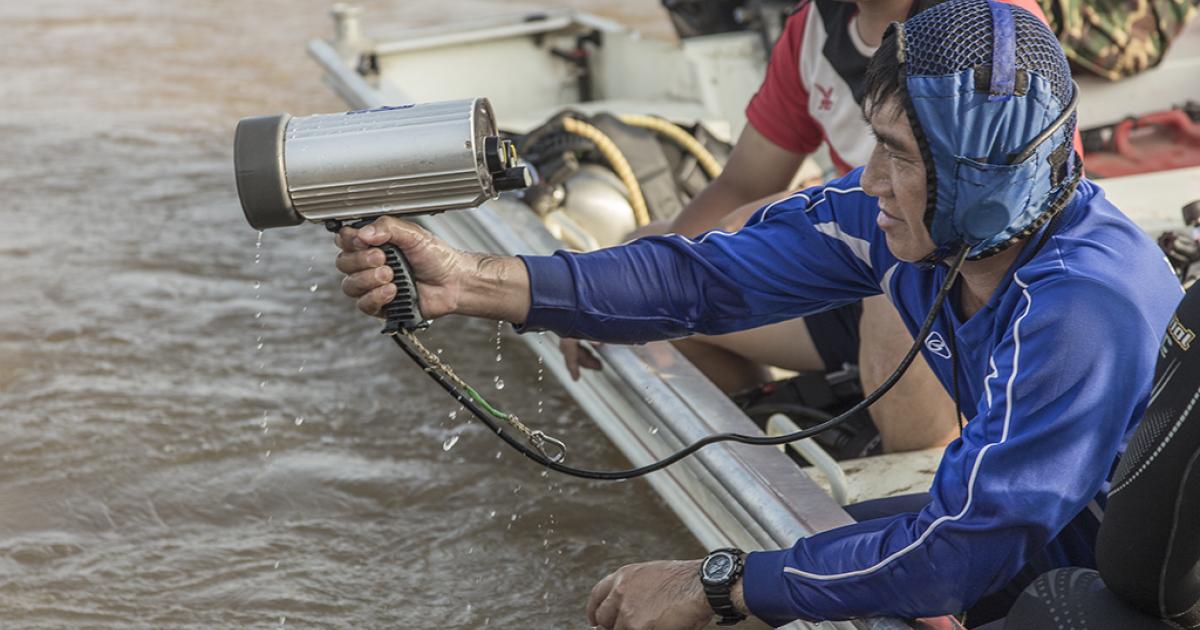 French and Singapore investigators provide sonar and acoustical locating equipment during the search and rescue of Lao Airlines Flight QV301. 