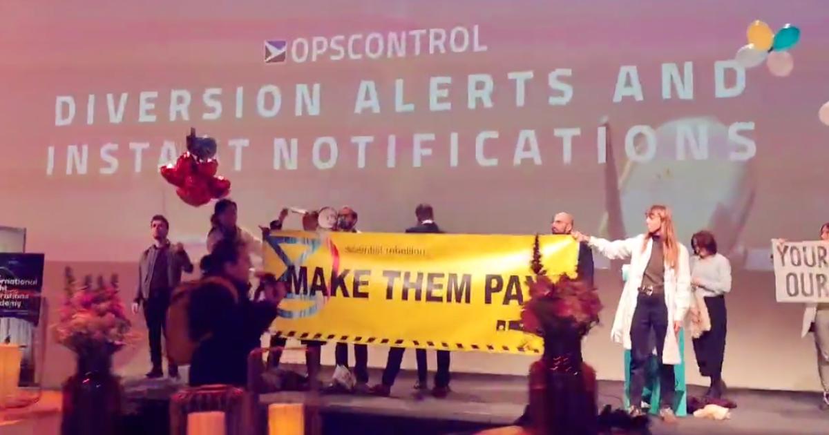 EBAA's AIROPS23 conference held this week in Brussels was interrupted by a group of environmental protestors who disrupted operations at Brussels Airport and managed to gain entry into the conference venue itself. (Screenshot: Environmental Extinction)