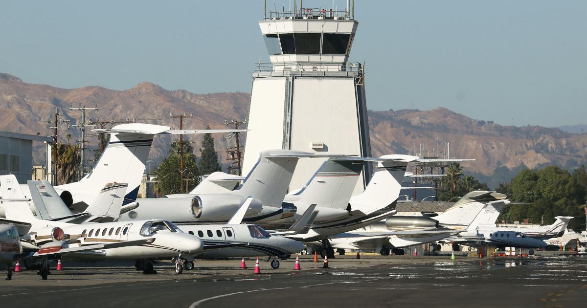 business jets on ramp in front of tower at Van Nuys Airport
