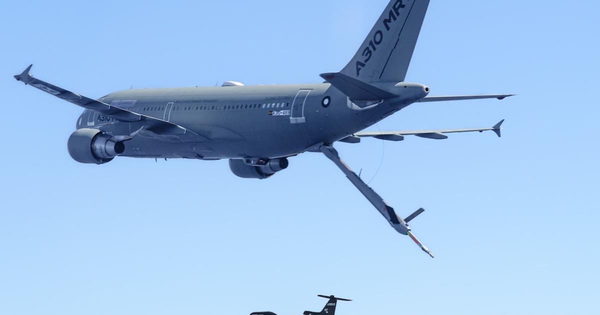 Airbus A310 MRTT with refueling boom extended over A Do-DT25 drone