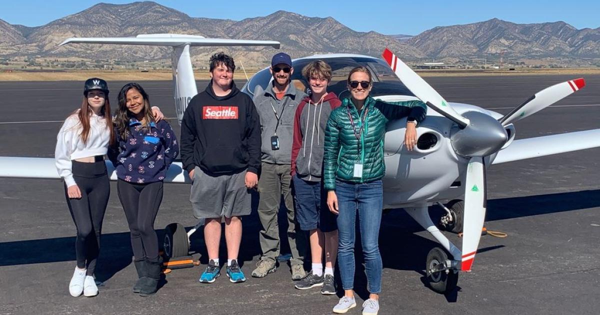 Students and instructors at Aspen Flight Academy pose with Diamond DA40NG aircraft