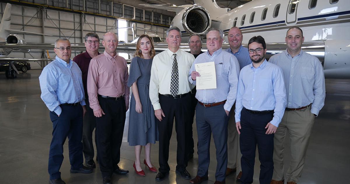 FAA officials presented Clay Lacy with a certificate for its successful participation in the agency's voluntary SMS program.