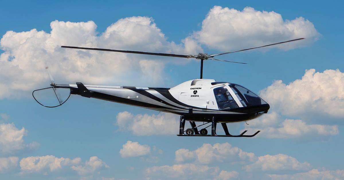 An Enstrom 280FX is pictured in flight at HAI's Heli-Expo 2023
