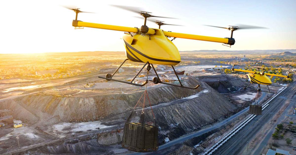A rendered image of a yellow Kaman Kargo UAV flying over a mine