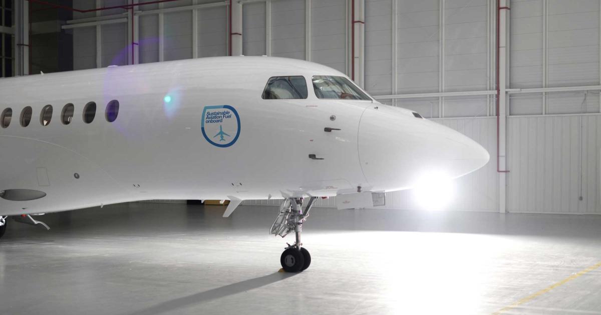 Dassault Falcon business jet with Sustainable Aviation Fuel decal on side