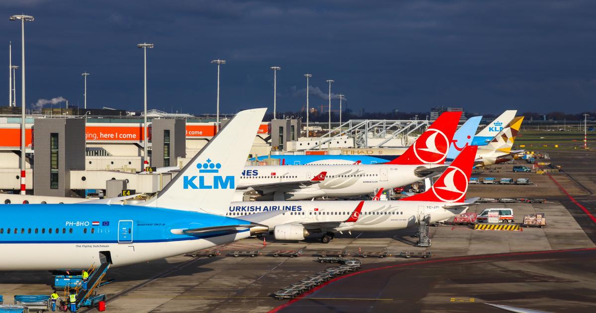 Various airliners parked at gates at Amsterdam Airport Schiphol 