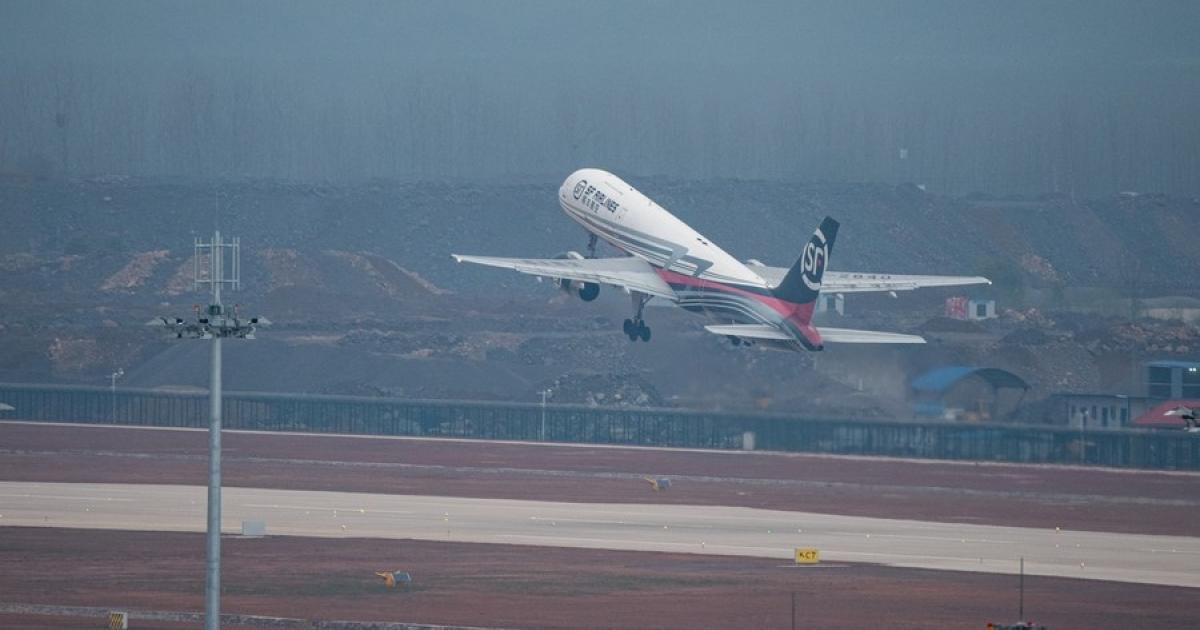 An SF Airlines Boeing 757 takes off for a flight trial at Ezhou Huahu Airport on March 19, 2022