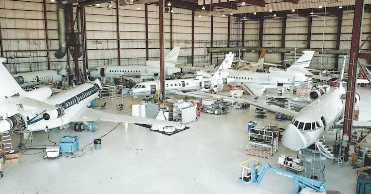 West Star hangar with multiple business jets being serviced
