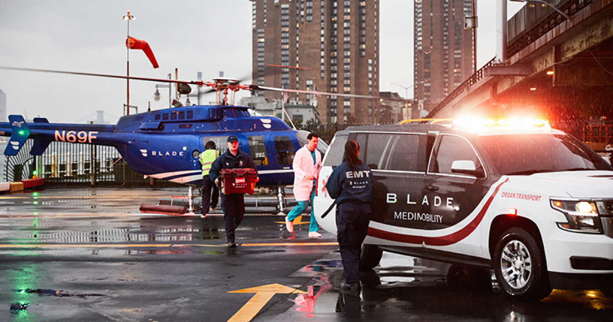 Blade MediMobility organ transport vehicle meets crew on helipad