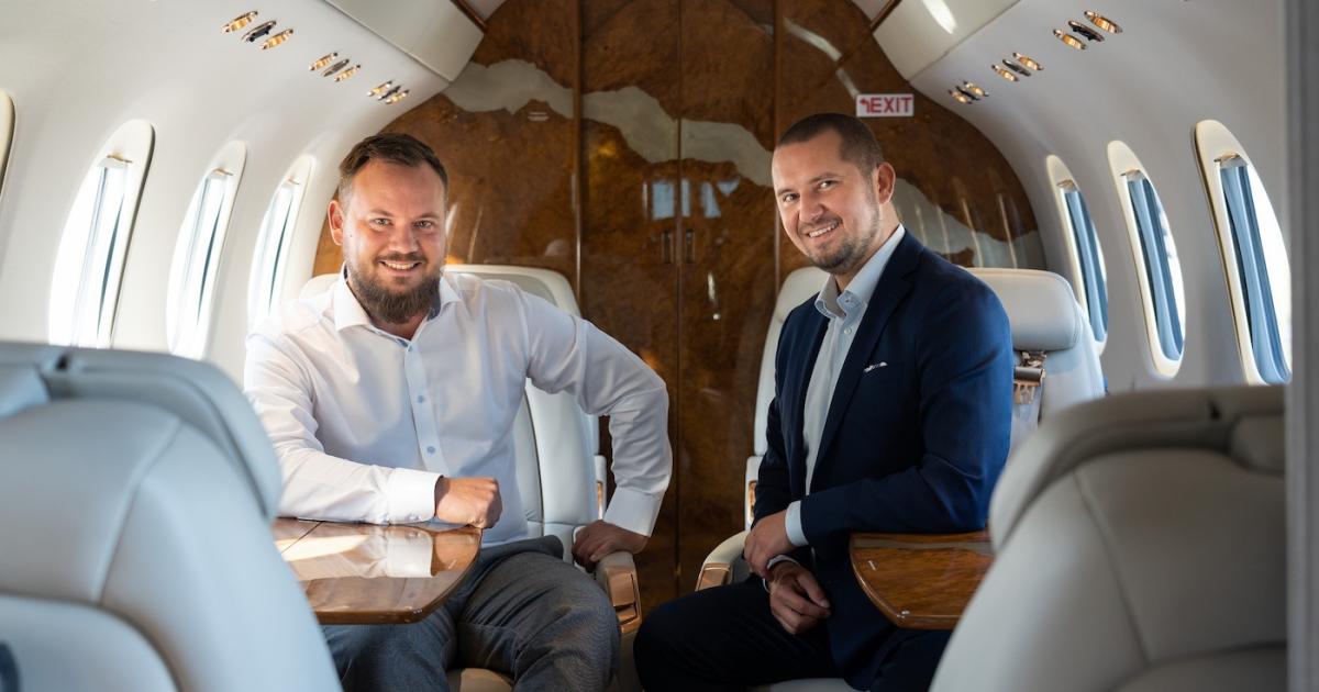 Gemini Wings founders Peter Duchovny (left) and Martin Feč in cabin of business jet
