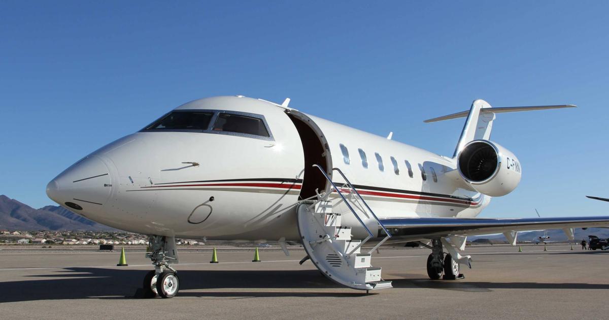 NetJets aircraft on airport ramp with door open