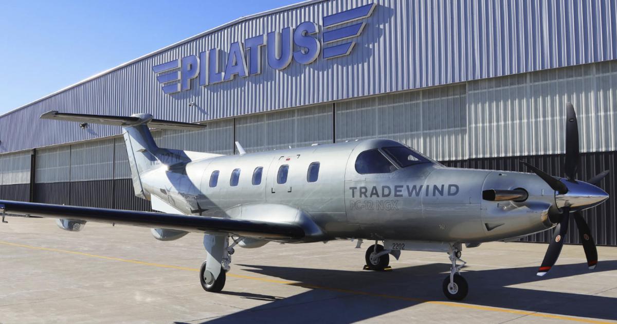 Tradewind branded Pilatus PC-12NGS on airport ramp outside of Pilatus hangar