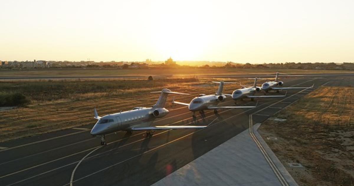 Vista fleet lined up on airport taxiway at sunset