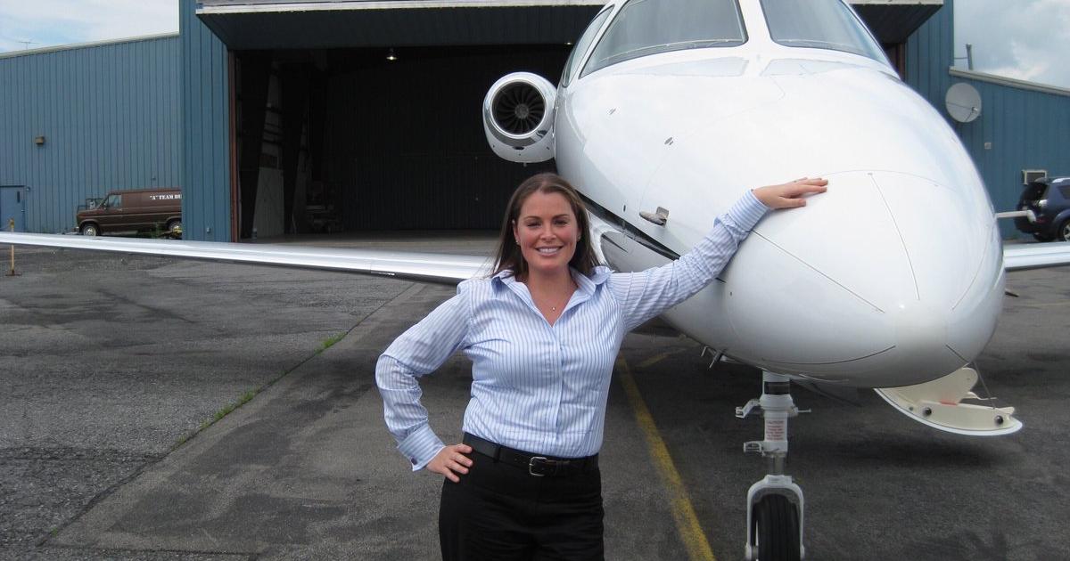 Jessica Webster in front of business jet