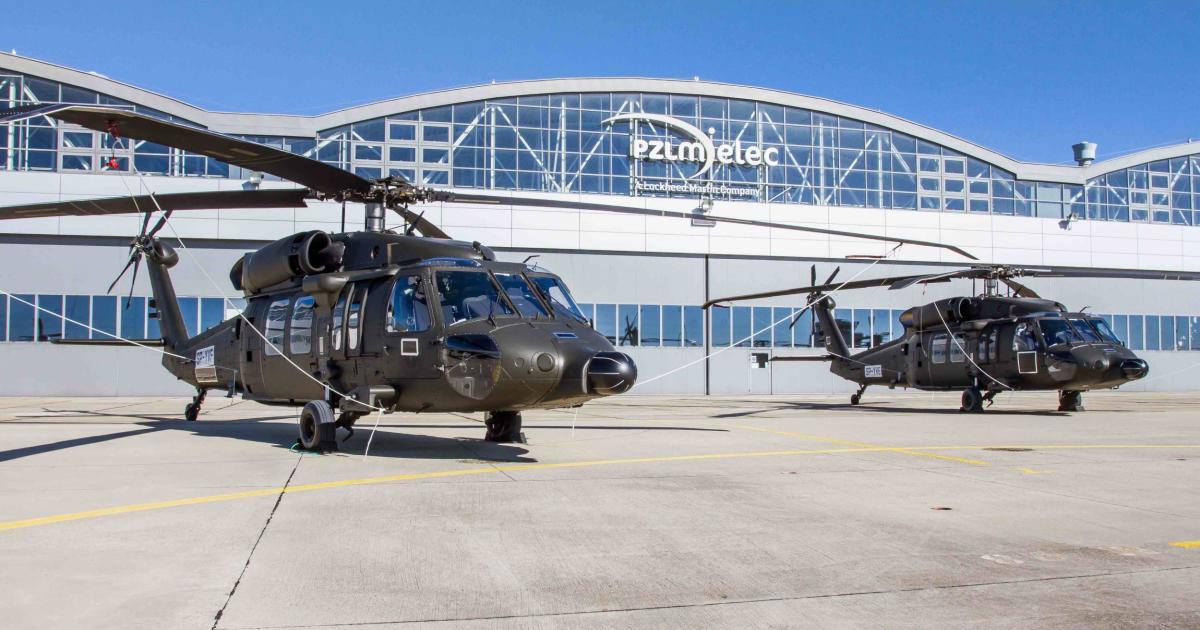 A pair of Sikorsky Black Hawks grace the tarmac outside PZL Mielec's factory in Poland.