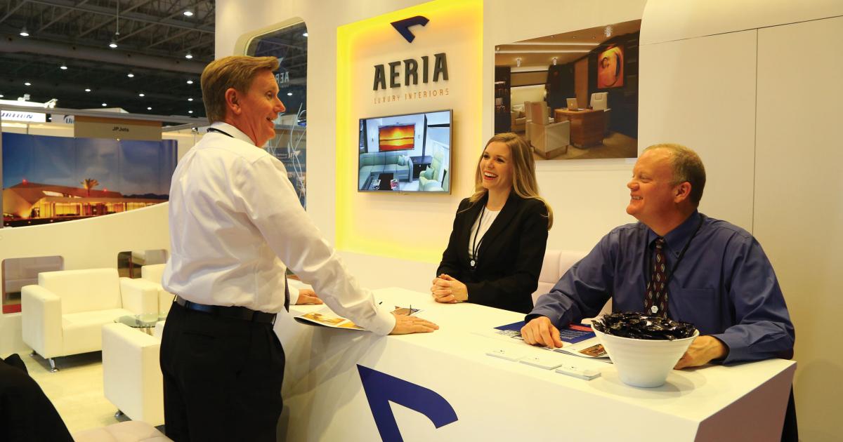 Aeria Luxury Interiors, a division of Singapore’s ST Aerospace displaying its completions expertise. At the stand are, left to right, Chris Mason, v-p of sales and marketing; Juleen Sanftner, marketing manager; and Boyd Hunsaker, director of sales and marketing. Photo: David McIntosh