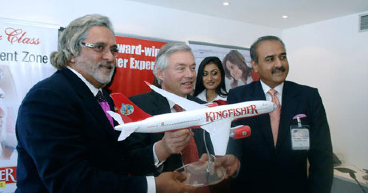 In more optimistic times, Kingfisher CEO Vijay Mallya, left; Airbus COO for customers John Leahy, center; and former Indian aviation minister Praful Patel pose with a model of an A350 following the signing of a major order for several Airbus types during the 2007 Paris Air Show. (Photo: Airbus)