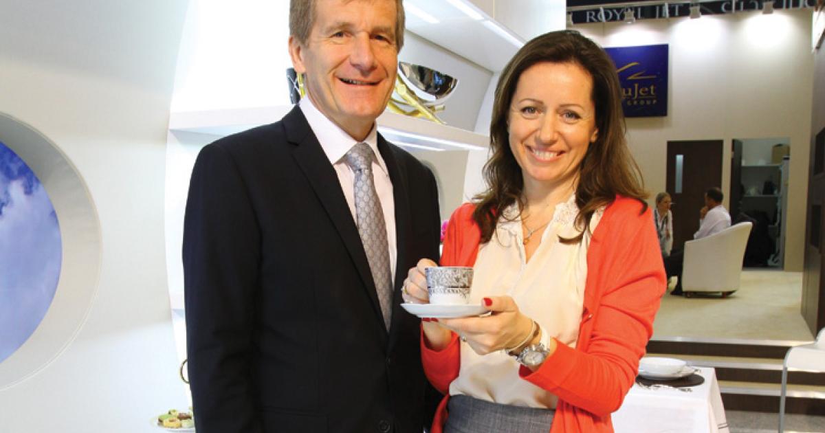 Thierry and Daniela Boutsen celebrate their company’s 251st aircraft sale, and its new design department, at MEBA 2012.