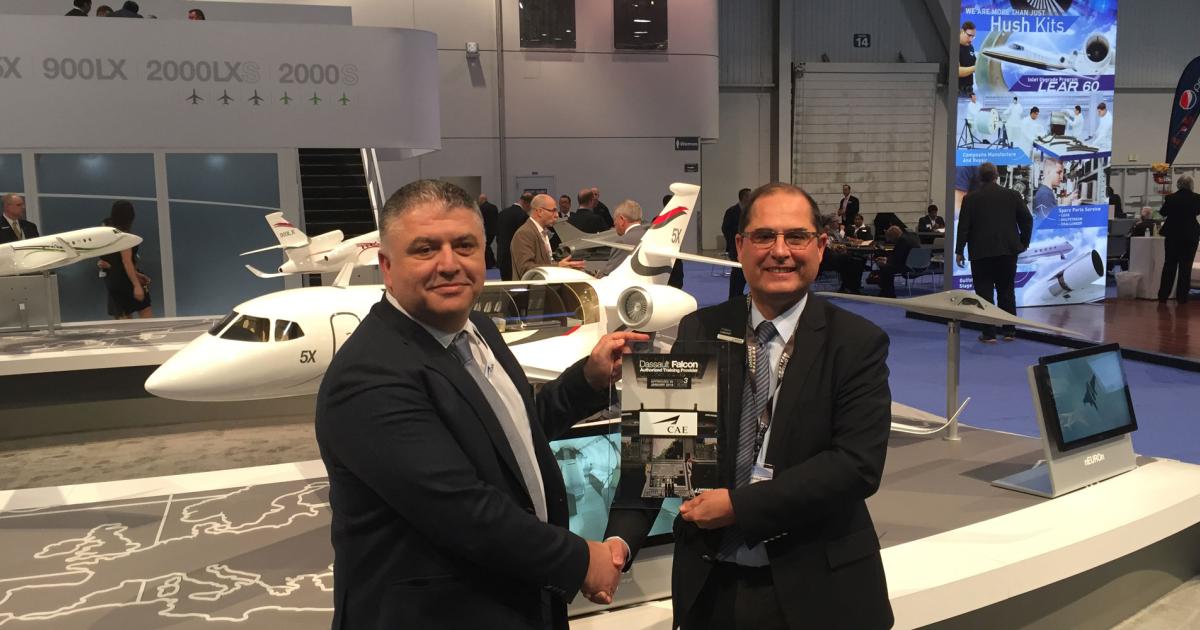 L-R: Camille Mariano, CAE v-p & general manager business aviation, helicopter and maintenance training; Frederic Lebouef, v-p Falcon operational support