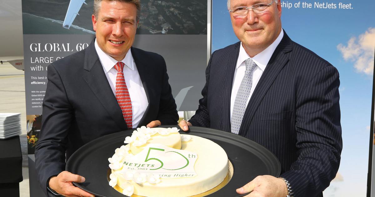 NetJets Europe CEO Mark Wilson, left, joins Bombardier Business Aircraft v-p of strategic partnerships Frank Ercolanese marking a landmark date in NetJets’ history.