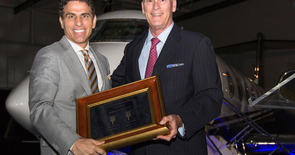 Flexjet chairman Kenn Ricci takes delivery of the fractional provider's first two Gulfstream G450LXis from Gulfstream Aerospace president Larry Flynn on June 23, 2015. The LXi-series Gulfstreams are exclusive to Flexjet and include customized interiors.