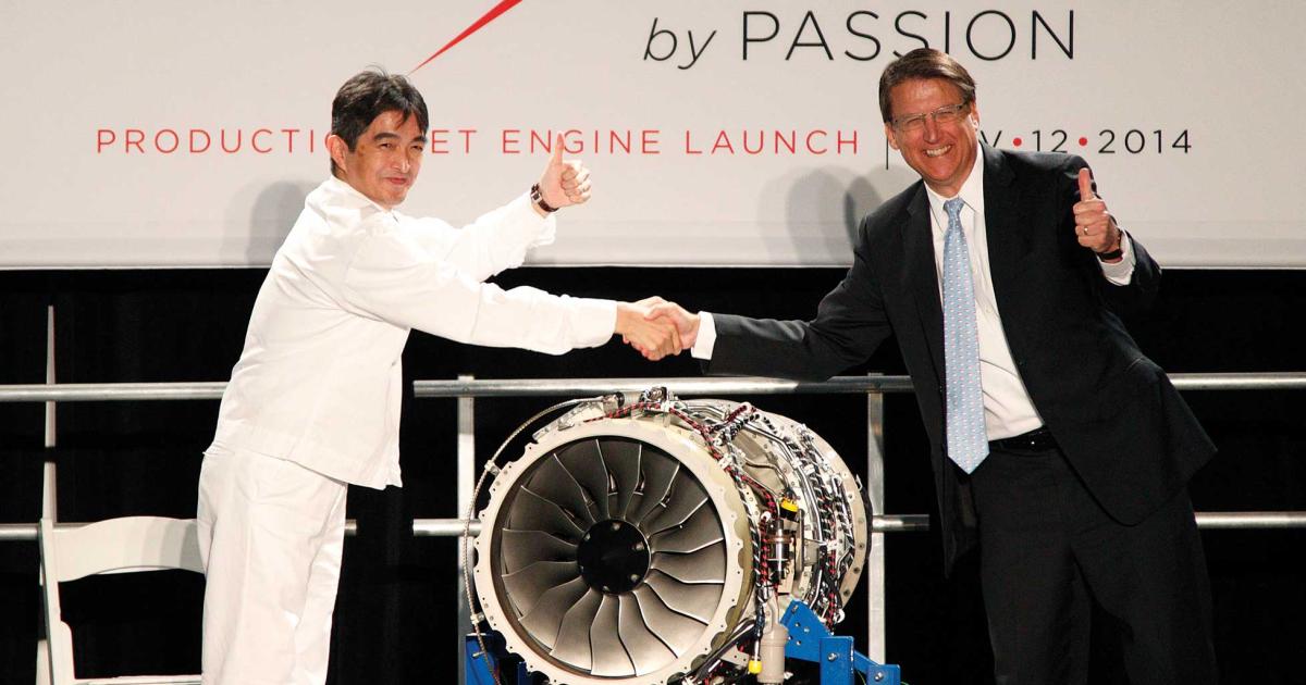 Honda Aero president and CEO Masahiko Izumi and North Carolina Governor Pat McCrory unveil the first HF120 produced at Honda Aero’s North Carolina headquarters.