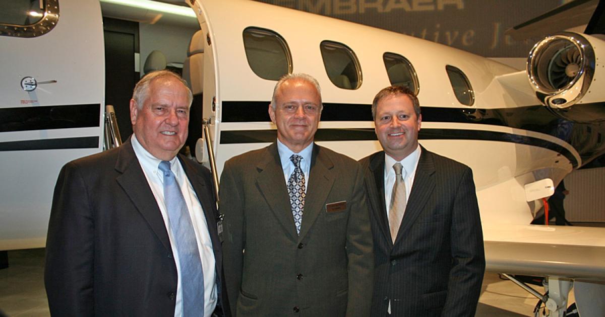 The first U.S.-assembled Phenom 100 light jet was delivered yesterday to Kansas City, Mo.-based fractional provider Executive AirShare at Embraer’s newly opened executive jet delivery center and Phenom final assembly plant in Melbourne, Fla. Celebrating the handover of the milestone airplane were (l-r) Executive AirShare chairman and CEO Bob Taylor, Embraer Executive Jets president Ernest Edwards and Executive AirShare president and COO Keith Plumb. (Photo: Chad Trautvetter)